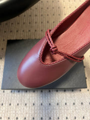 BOTTEGA VENETA 26S FLAT MULES IN DARK RED LAMBSKIN