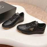 PRADA 25S DOWNTOWN SNEAKERS IN BLACK CALFSKIN