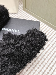 CHANEL 25S CLASSIC FURRY SLIDES IN BLACK WITH DOUBLE C LOGO