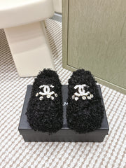 CHANEL 25S CLASSIC FURRY SLIDES IN BLACK WITH DOUBLE C LOGO