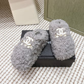 CHANEL 25S CLASSIC FURRY SLIDES IN GRAY WITH DOUBLE C LOGO