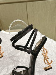 YSL 25S HIGH-HEEL SANDALS 100 MM IN BLACK SATIN WITH YSL LOGO HEEL DESIGN IN GOLD
