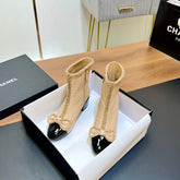 CHANEL 25S HEELED CHAIN BOOTS WITH BOW IN BEIGE CALFSKIN GOLD HARDWRE