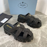 PRADA 25S MONOLITH RUBBER MULES IN BLACK RAFFIA AND LAMBSKIN