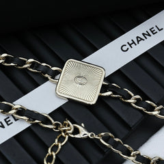 CHAIN CHOKER IN GOLD-PLATED METAL WITH LEATHER THROUGH LINKS