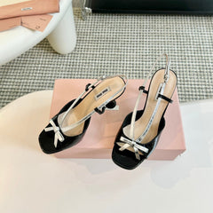 Black High Heels With Silver Bow