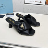 PRA CROSS MULE HEELS IN BLACK CALFSKIN WITH PADDED STRAPS