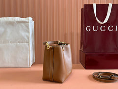 EMBLEM SMALL BUCKET BAG 19 IN BROWN SMOOTH CALFSKIN