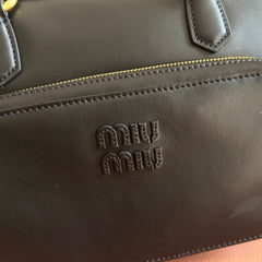 MIUMIU 26S POCKET TOP-HANDLE BAG 32 IN BLACK CALFSKIN GOLD HARDWARE