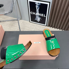 SLIPPERS IN GREEN GLOSSY CALFSKIN WITH BLACK HALF-FOOT SOCKS