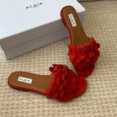 ALAIA FLAT MULE IN CHERRY RED SUEDE