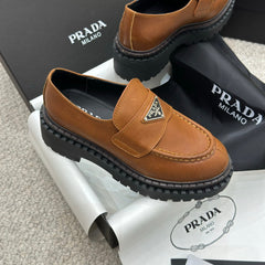 PRADA 25S LOAFER 50MM IN BURNT ORANGE CALFSKIN LOGO