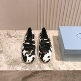 PRADA 25S CRYSTAL EMBELLISHED BALLERINA IN WHITE AND BLACK FUR