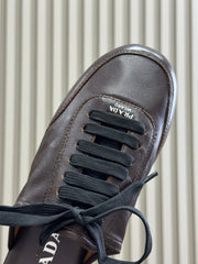 PRADA 25S COLLAPSE FLAT SHOES IN DARK BROWN CALFSKIN