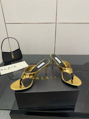 ALAIA HEELED THONG 25S IN GOLD PATENT LEATHER