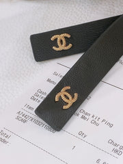 RIBBED BOW WAIST CHAIN IN GOLD TONE BRASS AND BLACK LAMBSKIN