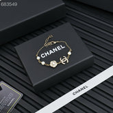 CC BRACELET 25P IN GOLD METAL PEARLY WHITE AND CRYSTAL