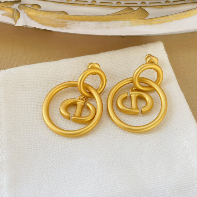 CD NAVY EARRINGS GOLD