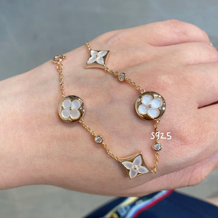 STAR AND SUN 4 MOTIF WHITE MOP PINK GOLD BRACELET