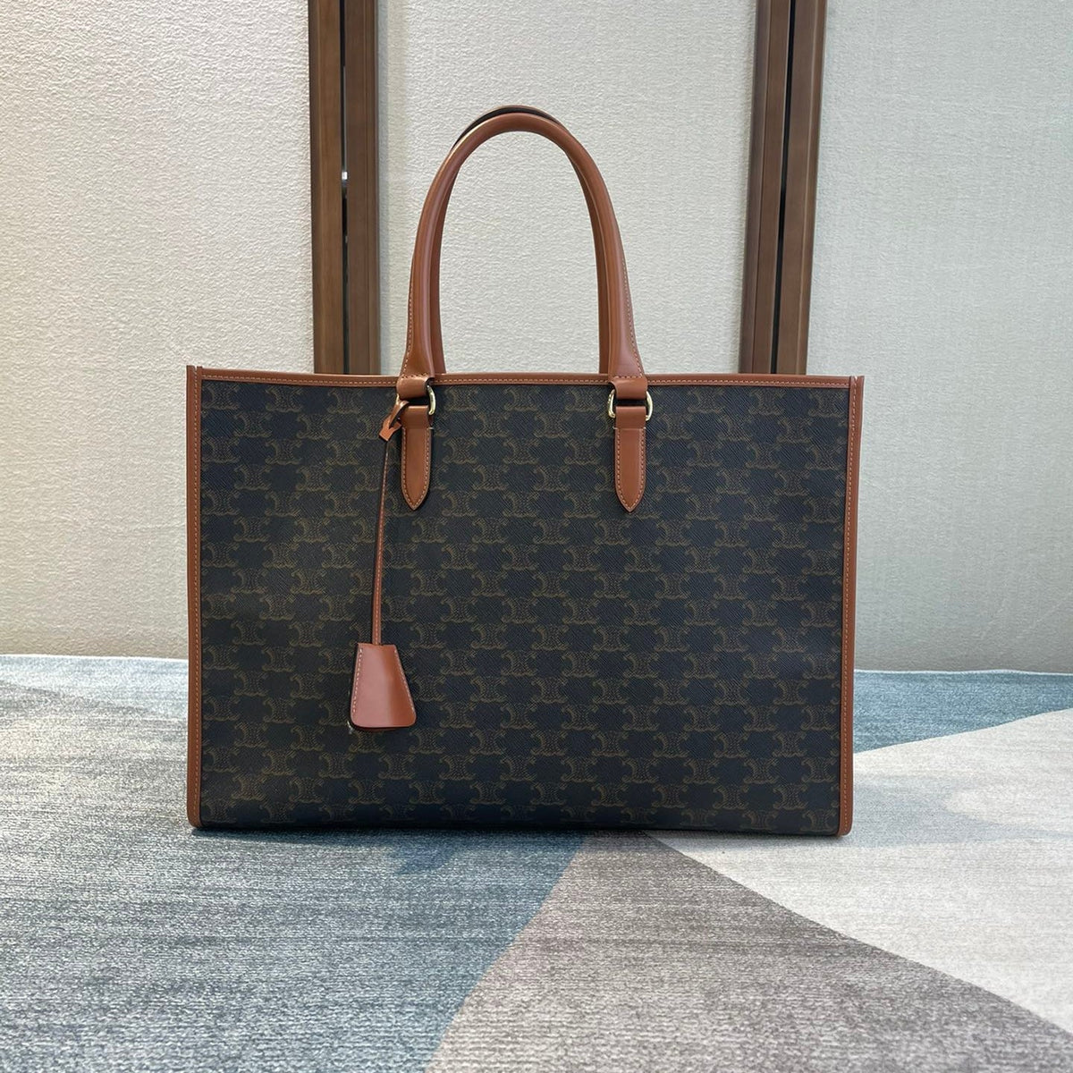 CELINE 25S HORIZONTAL CABAS 43MM IN BLACK TRIOMPHE CANVAS AND TAN BROWN CALFSKIN