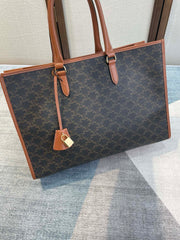 CELINE 25S HORIZONTAL CABAS 43MM IN BLACK TRIOMPHE CANVAS AND TAN BROWN CALFSKIN