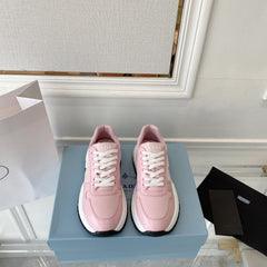 PRADA 25S THICK SOLE SNEAKER IN LIGHT PINK CALFSKIN AND CANVAS