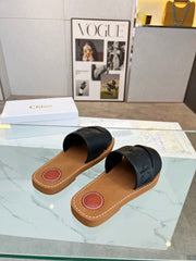 WOODY MULE IN BLACK LAMBSKIN WITH EMBROIDERED LOGO