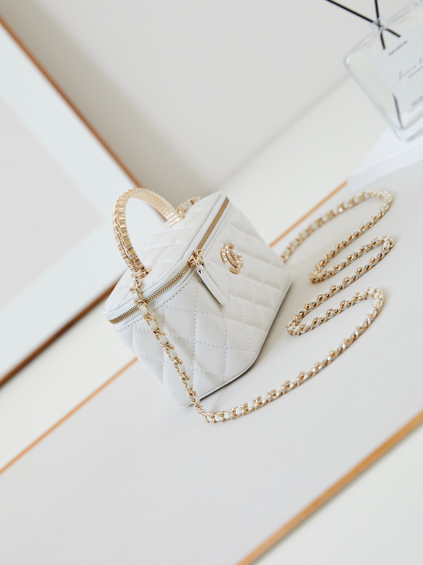 CHANEL 25S MINI VANITY BAG 16 CM IN WHITE LAMBSKIN WITH CRYSTAL-EMBELLISHED CC LOGO