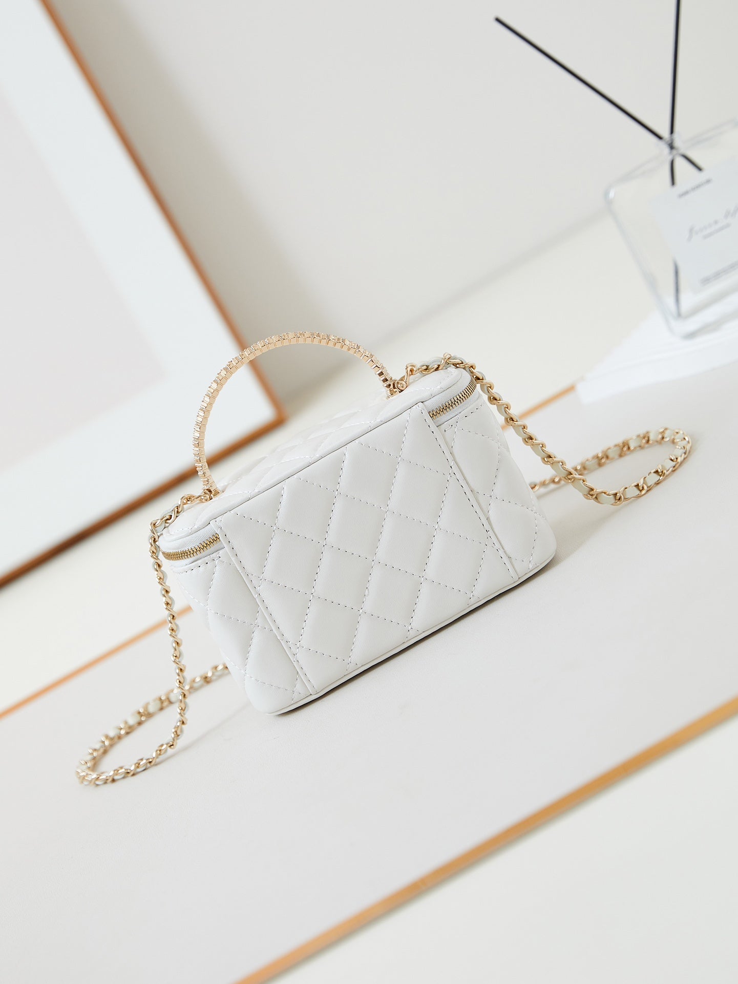 CHANEL 25S MINI VANITY BAG 16 CM IN WHITE LAMBSKIN WITH CRYSTAL-EMBELLISHED CC LOGO