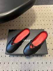 BOTTEGA VENETA 26S FLAT MULES IN BLACK LAMBSKIN