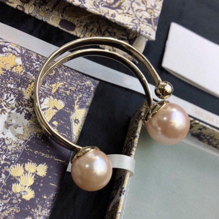 DIO TRIBALES BANGLE GOLD AND PEARL PINK BRACELET