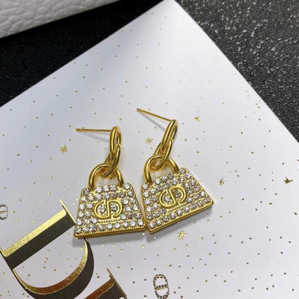 CD BAG GOLD DIAMOND EARRINGS