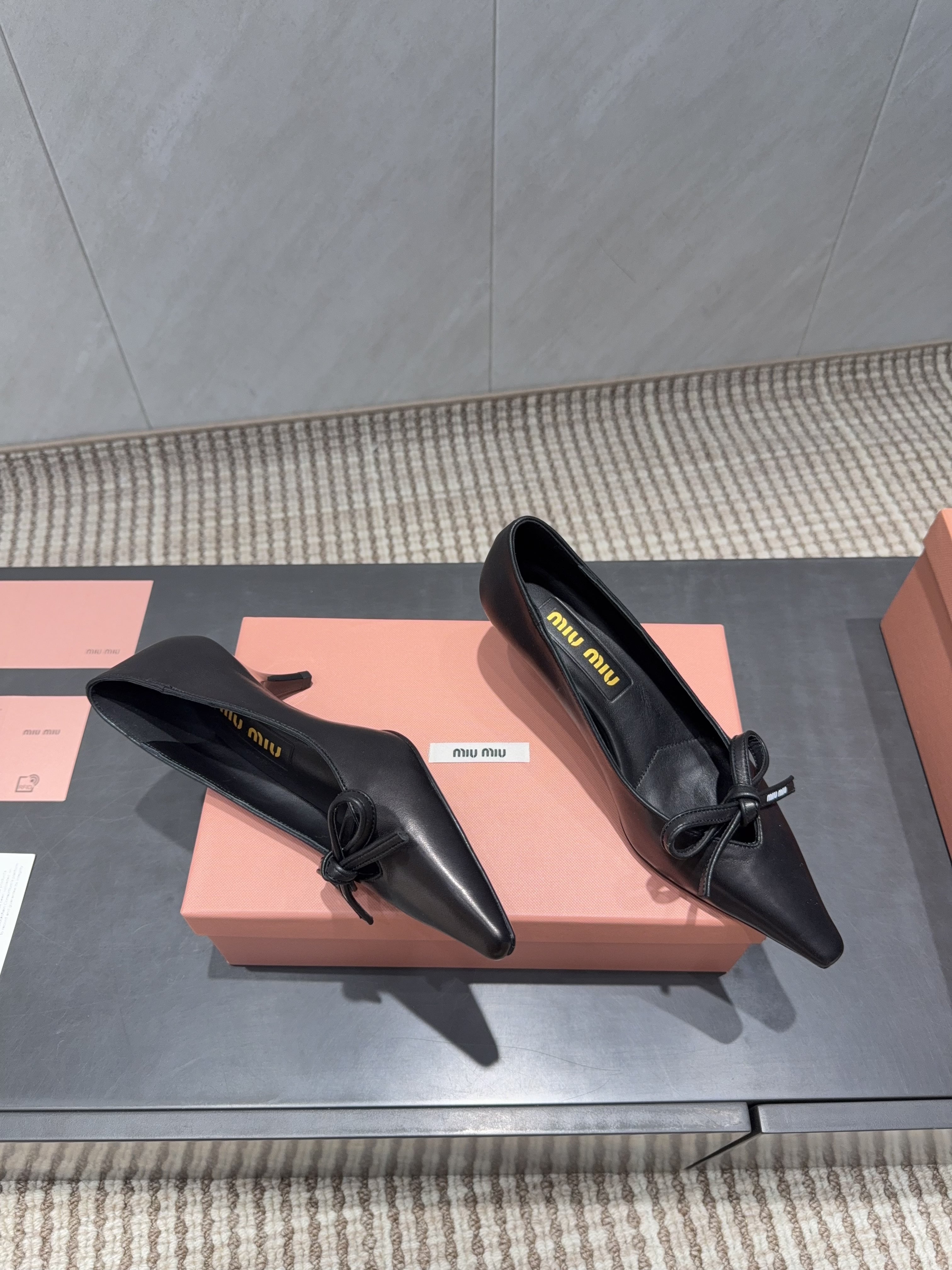 MIUMIU 26S POINTED TOE PUMPS 55MM IN BLACK CALFSKIN WITH BOW