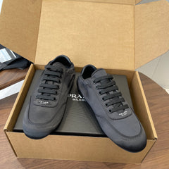 PRADA 25S SNEAKER IN BLACK SILK