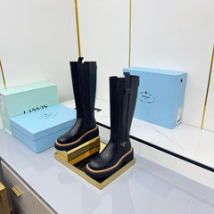PRADA 25S TALL CHELSEA BOOTS 50MM IN BLACK CALFSKIN
