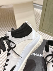 CHANEL 25S HIGH-TOP SNEAKERS IN BLACK AND WHITE CALFSKIN AND SUEDE