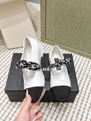 CHANEL 25S MARY JANES IN WHITE AND BLACK SHEARLING AND GROS GRAIN