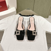 CRYSTAL HEEL MULE IN BLACK PATENT CALFSKIN WITH EMBELLISHED BUCKLE