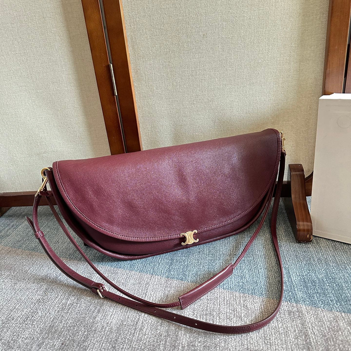 CELINE 25S HALFMOON SOFT TRIOMPHE BAG 46MM IN SYRAH RED SUPPLE SHINY LAMBSKIN