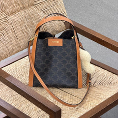 CELINE 25S SMALL CUBE BAG 21MM IN BLACK TRIOMPHE CANVAS AND BORWN CALFSKIN