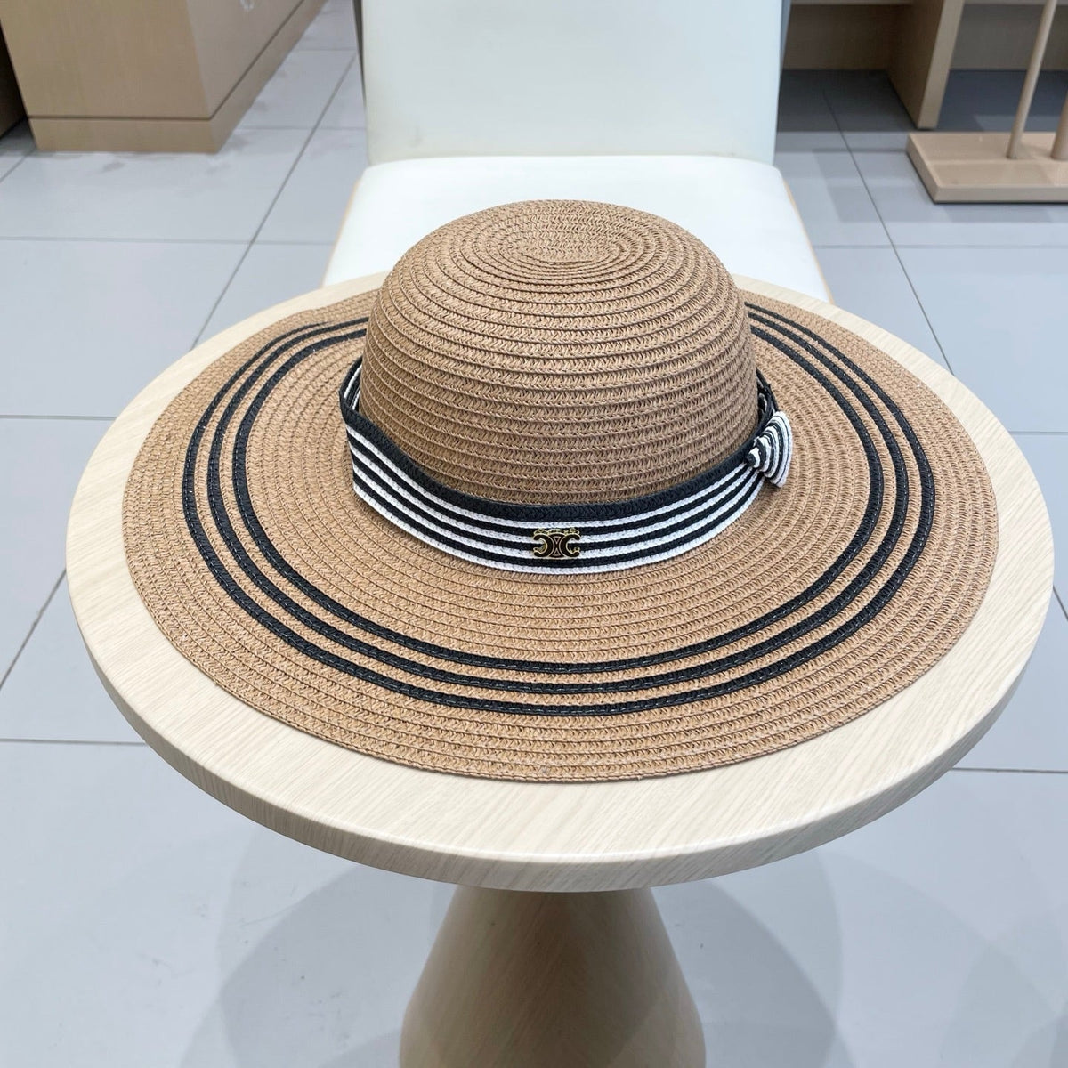 WIDE BRIM HAT MODEL 650410 IN BROWN WITH BLACK STRIPES WOVEN STRAW