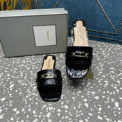 FLAT MULE IN BLACK CALFSKIN