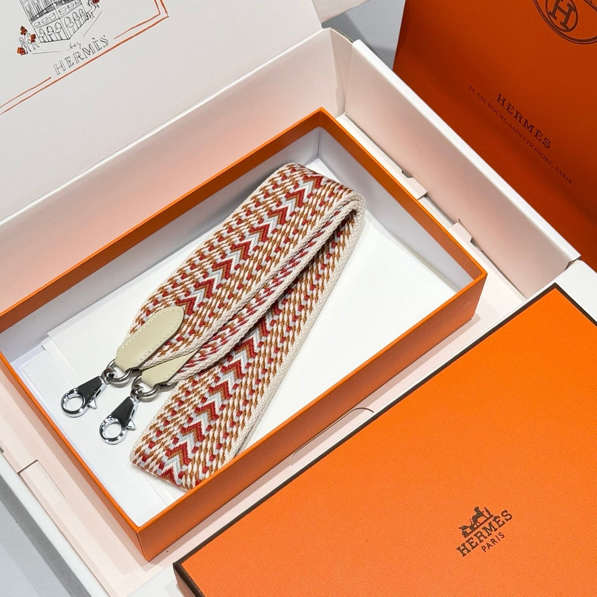 25S HERMES BAG STRAP ORANGE AND RED PATTERN 85 IN CANVAS SILVER HARDWARE