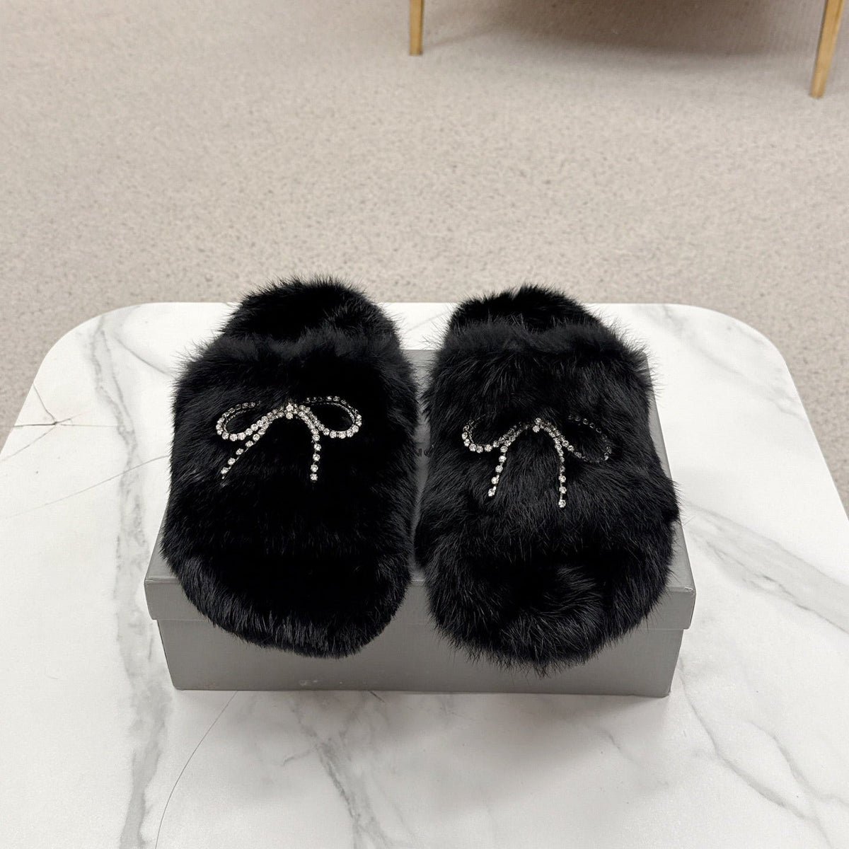 BALENCIAGA 25S SOFT FUR SLIPPERS IN BLACK FUR WITH RHINESTONE BOW