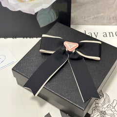 BOW HAIR CLIP IN BLACK MIX BEIGE FABRIC 406108