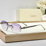 C DE RIMLESS ROUND FRAME SUNGLASSES CT0611S IN METAL