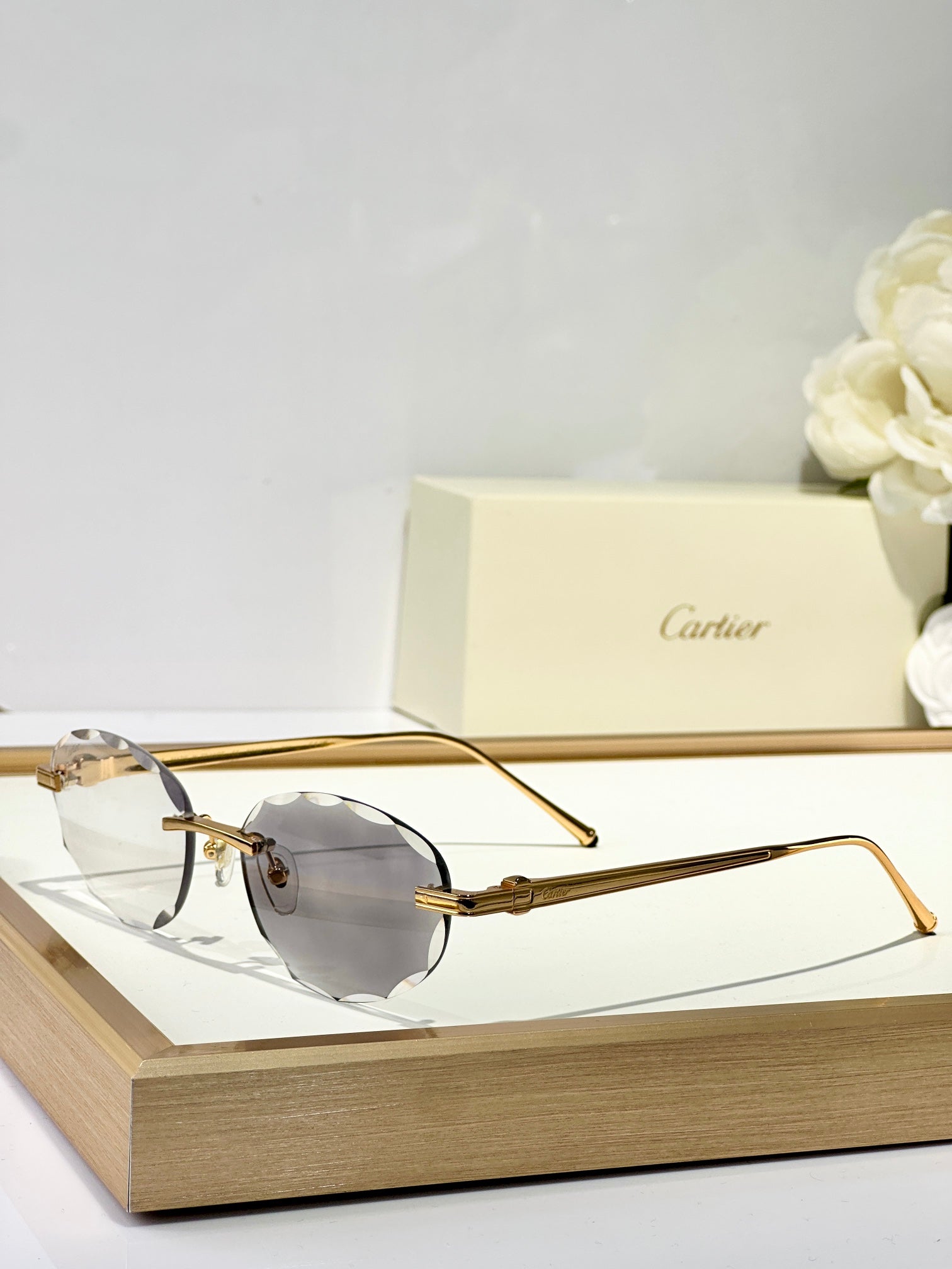 C DE RIMLESS ROUND FRAME SUNGLASSES CT0611S IN METAL