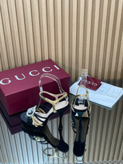 GUCCI 26S HIGH-HEELED SANDALS 125 MM IN BLACK SATIN AND GOLD CALFSKIN