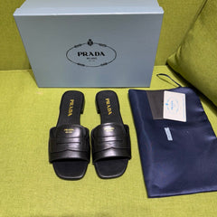 PRADA 25S SLIDES IN BLACK CALFSKIN