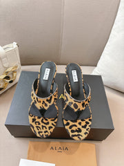 ALAIA HEELED THONG 25S 55 MM IN LEOPARD PONY HAIR LEATHER